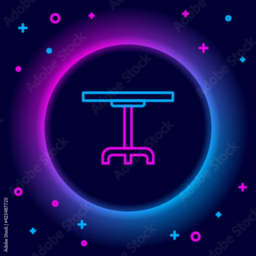 Glowing neon line Round table icon isolated on black background. Colorful outline concept. Vector