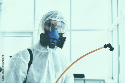 close-up. Sanitation worker in a bacteriological protection suit .