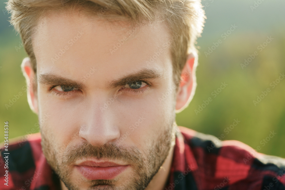 Handsome bearded man closeup portrait. Hipster appearance.