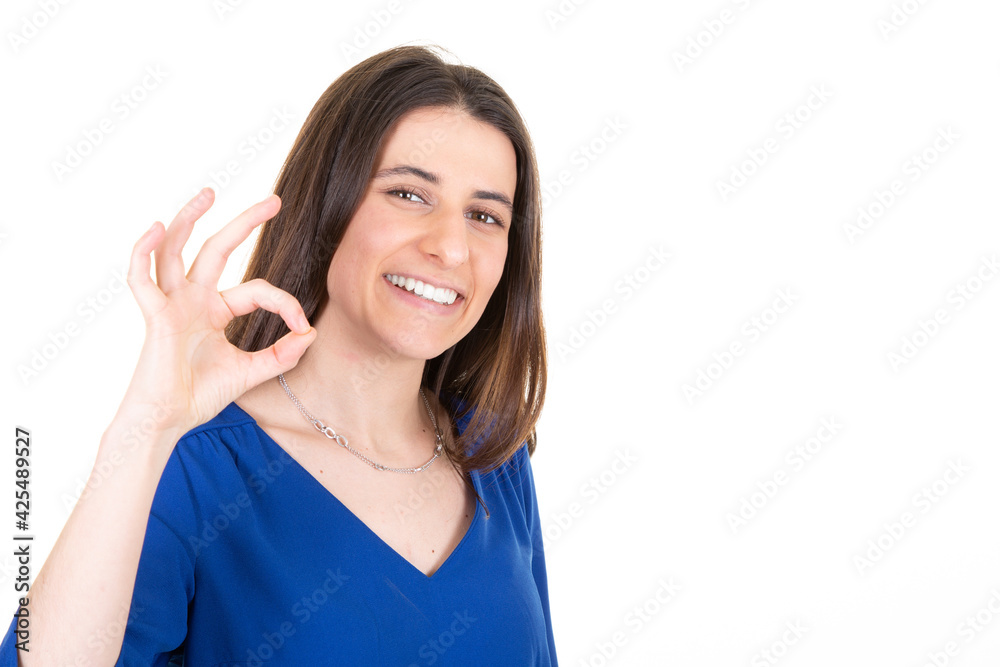 Happy smiling blurry woman fingers showing ok sign and looking at camera Happy smiling blurry woman fingers showing ok sign and looking at camera