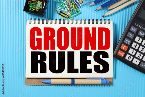 ground rules. TEXT ON WHITE NOTEBOOK PAPER on blue background near calculator