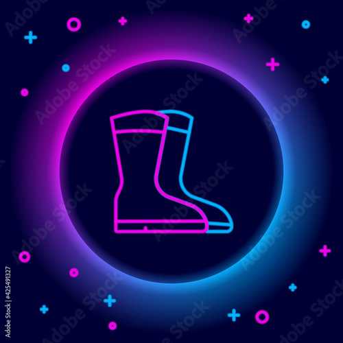 Glowing neon line Fishing boots icon isolated on black background. Waterproof rubber boot. Gumboots for rainy weather, fishing, hunter, gardening. Colorful outline concept. Vector