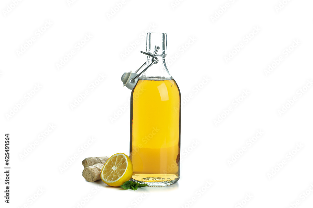 Bottle of ginger beer and ingredient isolated on white Bottle of ginger beer and ingredient isolated on white