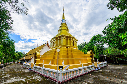 Golden Pagoda of Wat Phrathat Phu Khwang at Phu Kam Yao District photo