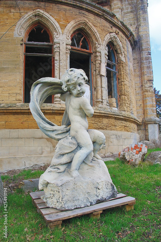 A statue of a boy in the courtyard of the Kurisov estate. photo