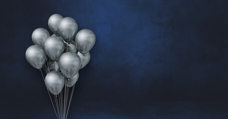 Silver balloons bunch on a black wall background. Horizontal banner.