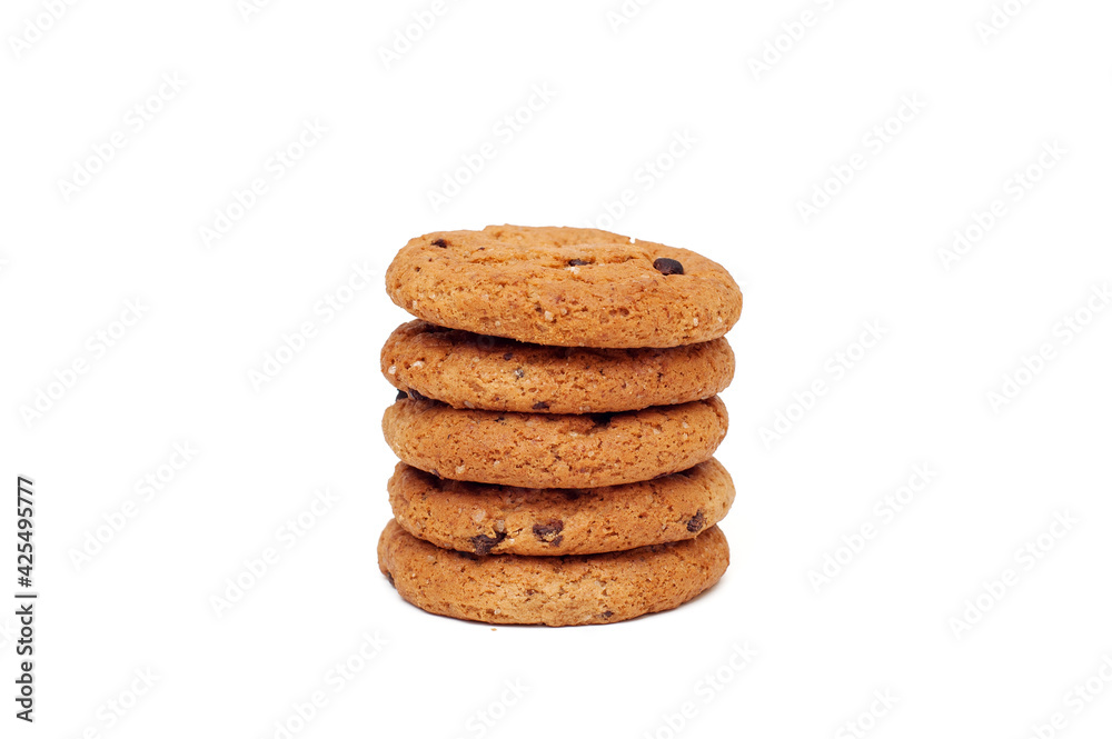 Stack of oatmeal cookies with chocolate pieces isolated on white