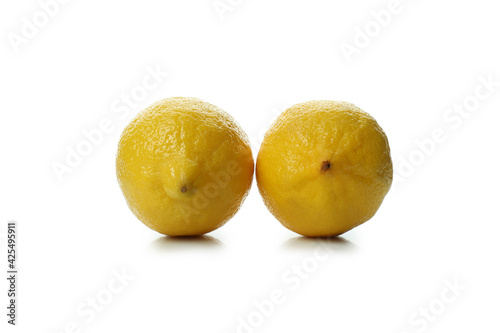 Two ripe lemons isolated on white background