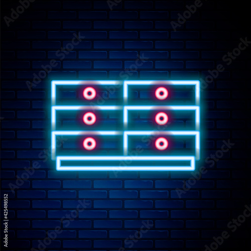 Glowing neon line Chest of drawers icon isolated on brick wall background. Colorful outline concept. Vector