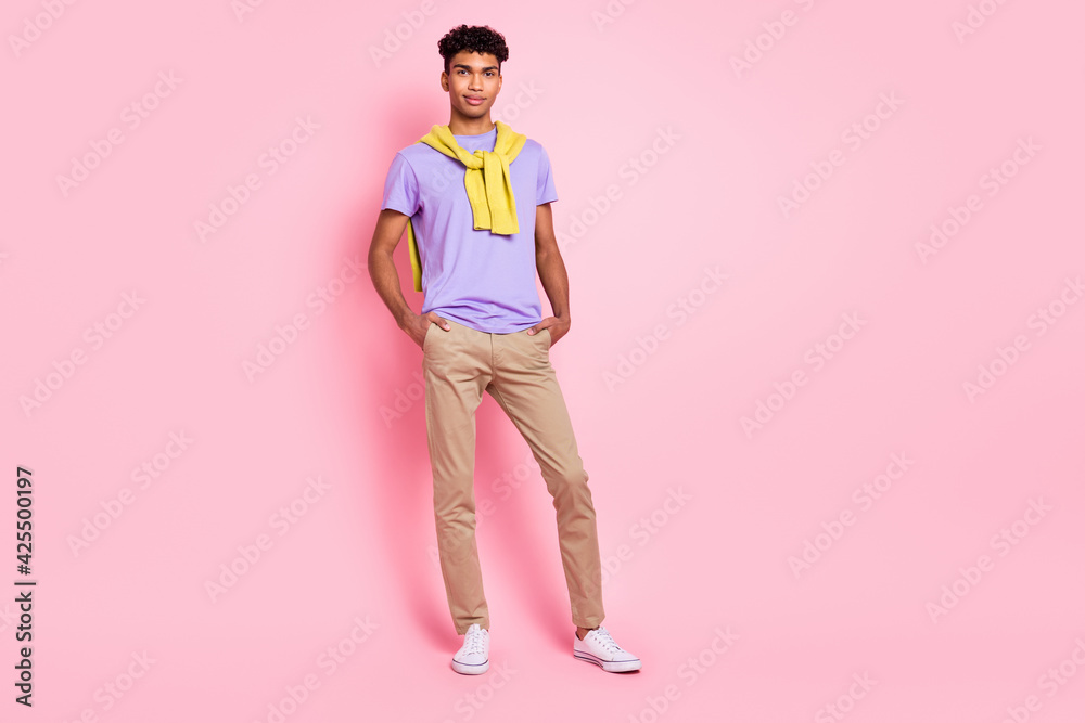 Full body photo of young handsome african man confident cool hands in pocket isolated over pink color background