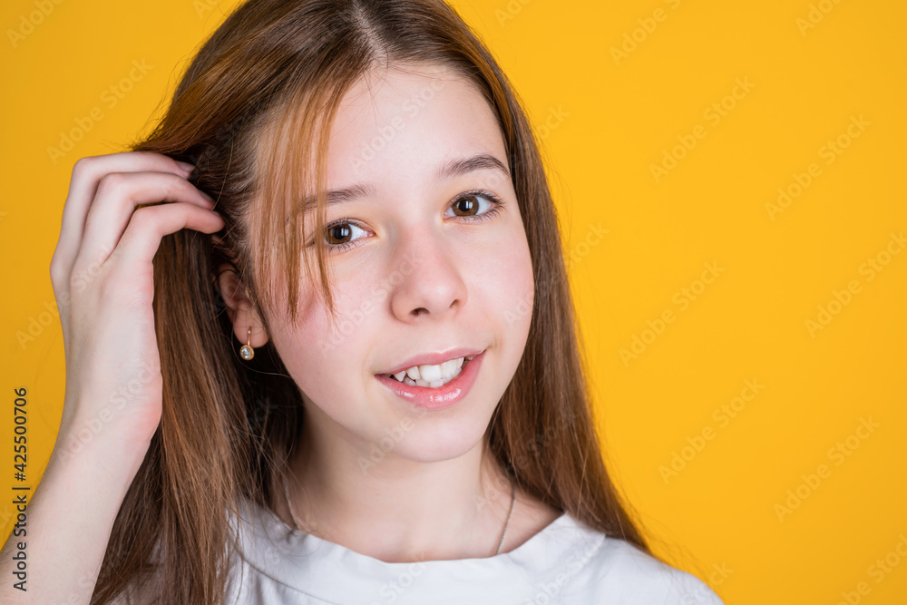 teen girl touch long hair has perfect tender skin, beauty