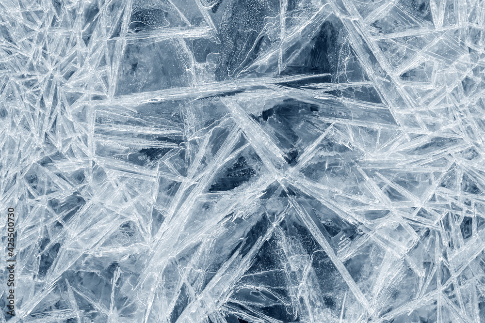 Ice background texture. Frozen water in various geometric abstract shapes. Seasonal natural effect. Cold weather. The surface of the winter water reservoir. Ice background texture. Frozen water in various geometric abstract shapes. Seasonal natural effect. Cold weather. The surface of the winter water reservoir.
