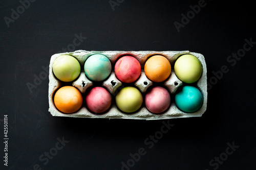 Easter eggs. colored eggs. Place for text. Black background. 