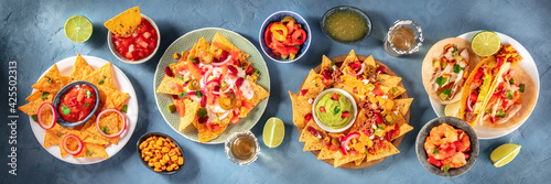 Mexican food panorama with nachos and tequila photo