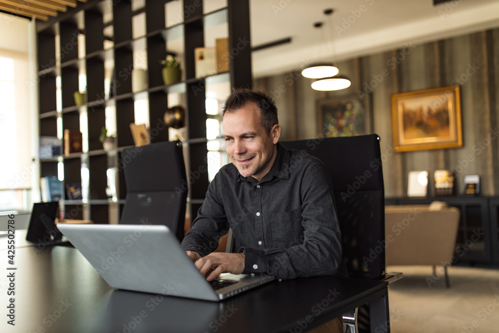 Successful businessman at work, portrait. Successful businessman at work, portrait.