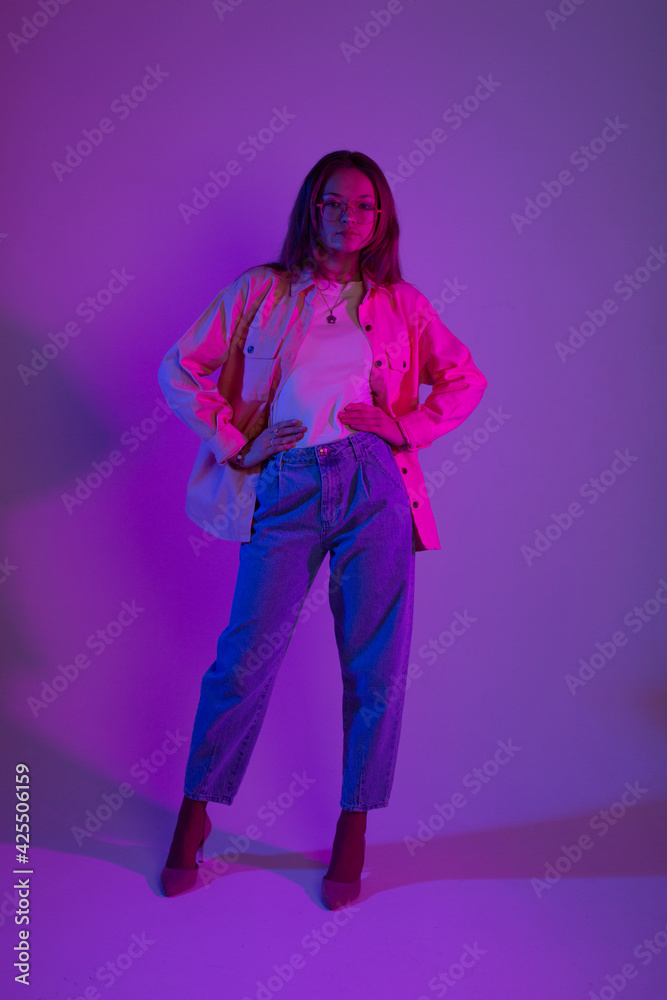 Art portrait with color filters in studio. Fashion model posing alone