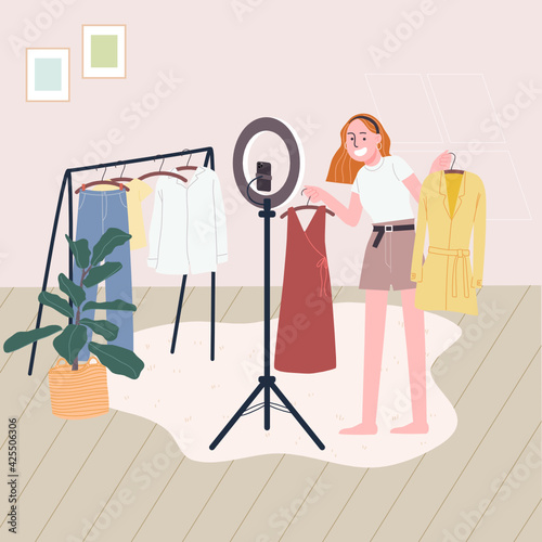 Flat style vector illustration of cartoon woman character selling clothes online while broadcast live video at home. Concept of e-commerce, online selling, live streaming.