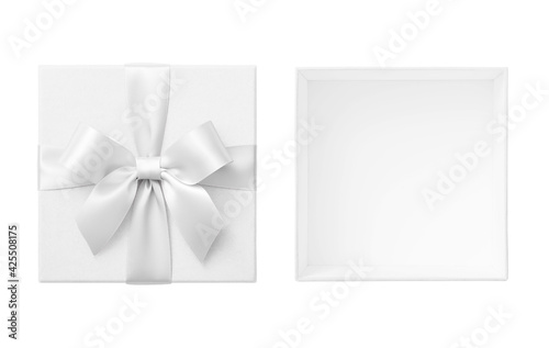 Open white gift box with lid and white bow cut out on white background, wedding present top view