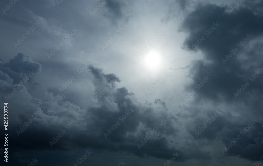 Sunset with sun rays, sky with clouds and sun.