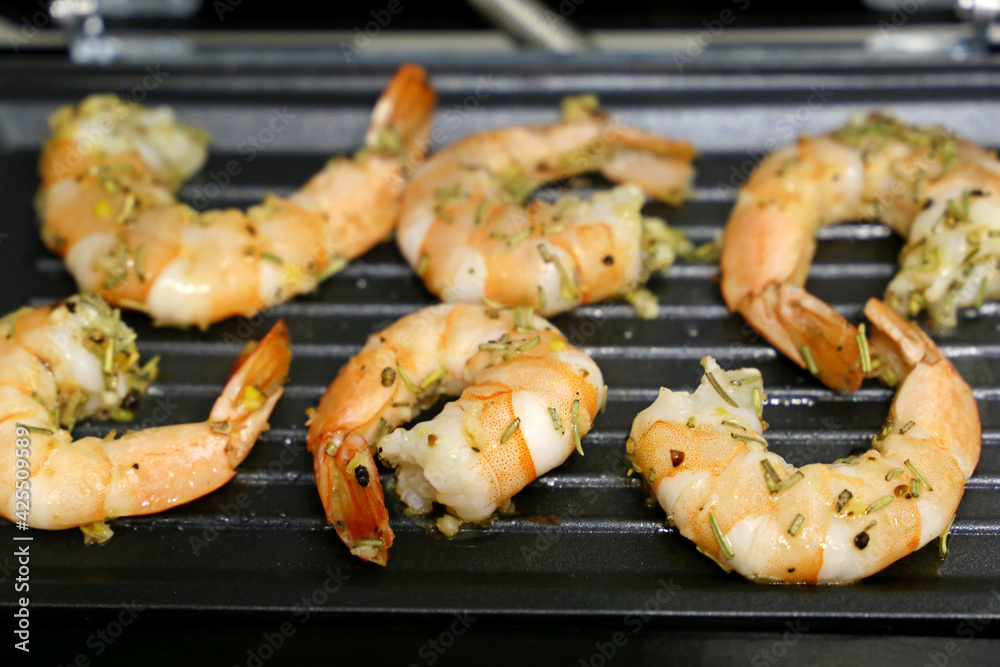 Shrimps are grilled with spices. Cooking prawns, delicious dish Shrimps are grilled with spices. Cooking prawns, delicious dish