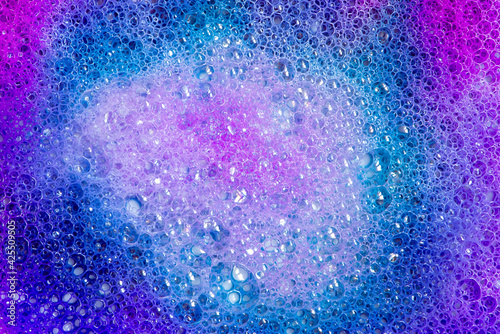 Pink, purple and blue foam full of bubbles, abstract background
