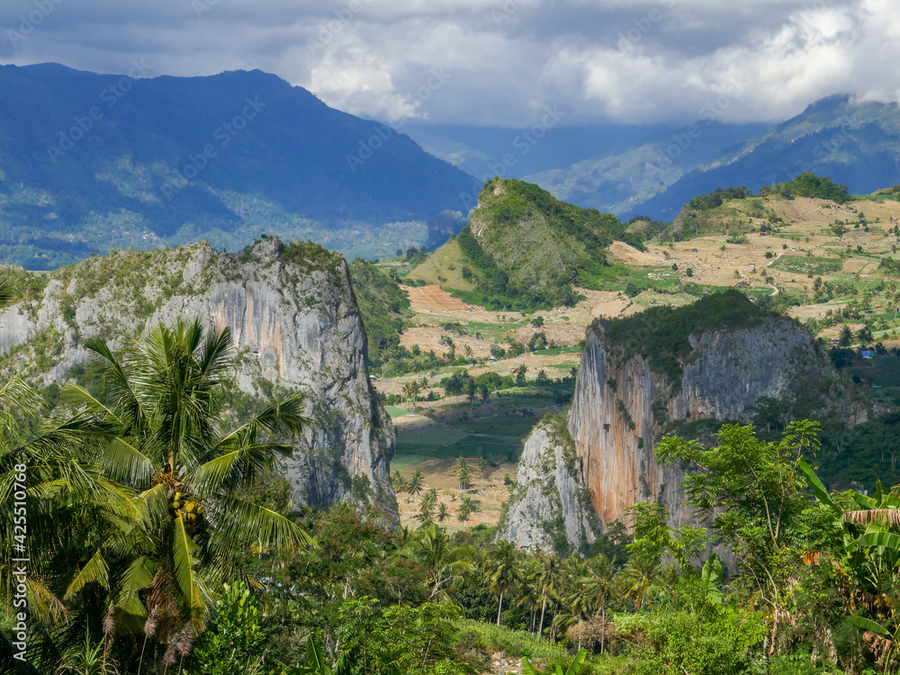 Naklejka premium Scenic mountain landscape with moody sky near Puncak Lakawan, Enrekang, South Sulawesi, Indonesia