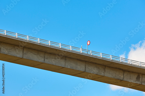 No overtaking traffic signal on a bridge. Warning photo