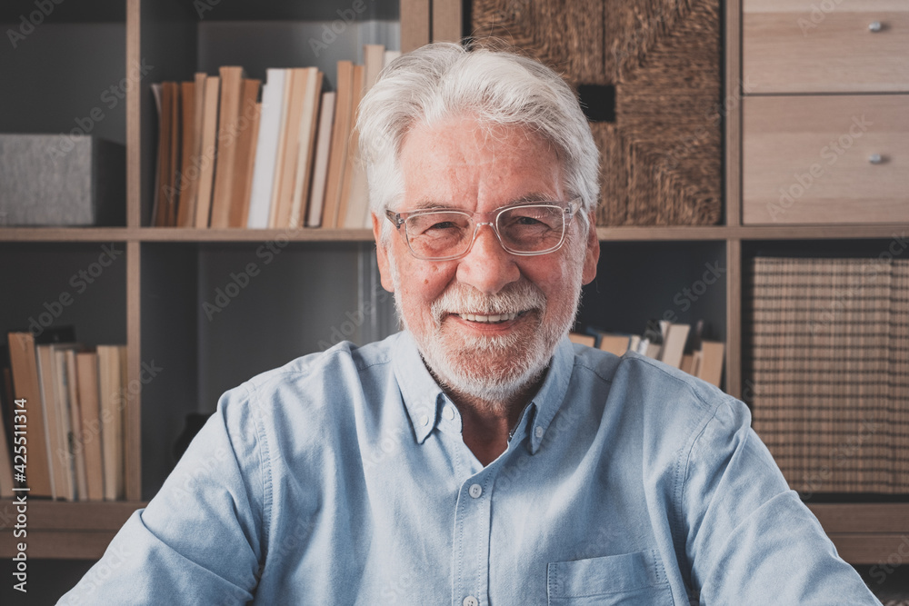 Portrait of one old cheerful male senior smiling having fun at home. Mature caucasian man studying independent looking at the camera and posing to picture.
Portrait of one old cheerful male senior smiling having fun at home. Mature caucasian man studying independent looking at the camera and posing to picture.