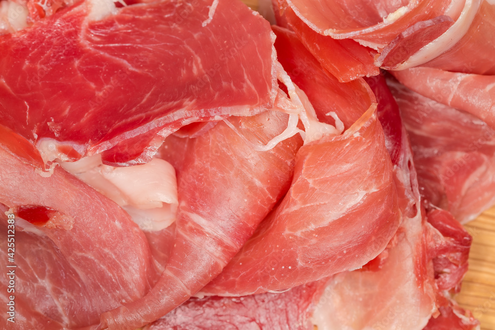 Background of jamon slices close-up, top view Background of jamon slices close-up, top view
