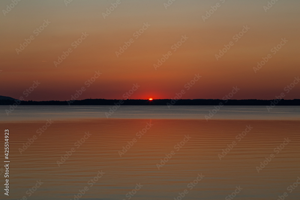 sunset over lake Chiemsee in the bavarian alps in Germany