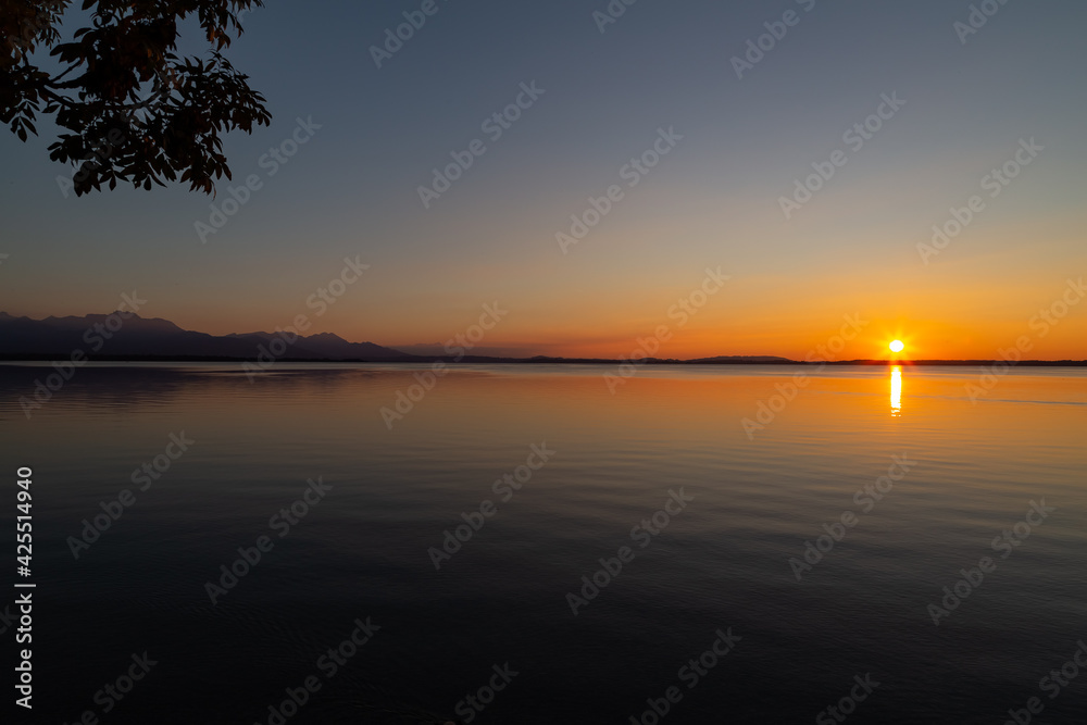 sunset over lake Chiemsee in the bavarian alps in Germany
