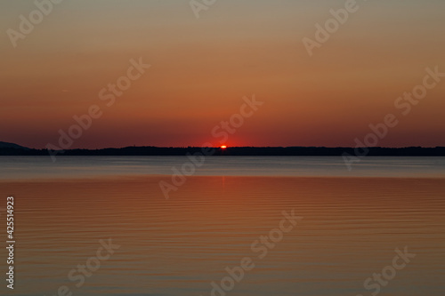 sunset over lake Chiemsee in the bavarian alps in Germany