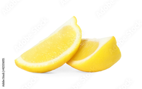 Fresh ripe lemon slices on white background