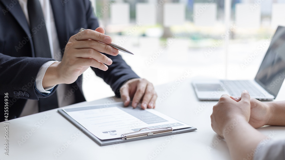 Employer or HR department is reading the resume and interviewing the ability of new employees, Employer is selecting job applicants, Employment and Recruitment Concept. Employer or HR department is reading the resume and interviewing the ability of new employees, Employer is selecting job applicants, Employment and Recruitment Concept.