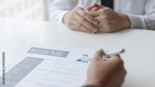 Employer or HR department is reading the resume and interviewing the ability of new employees, Employer is selecting job applicants, Employment and Recruitment Concept.