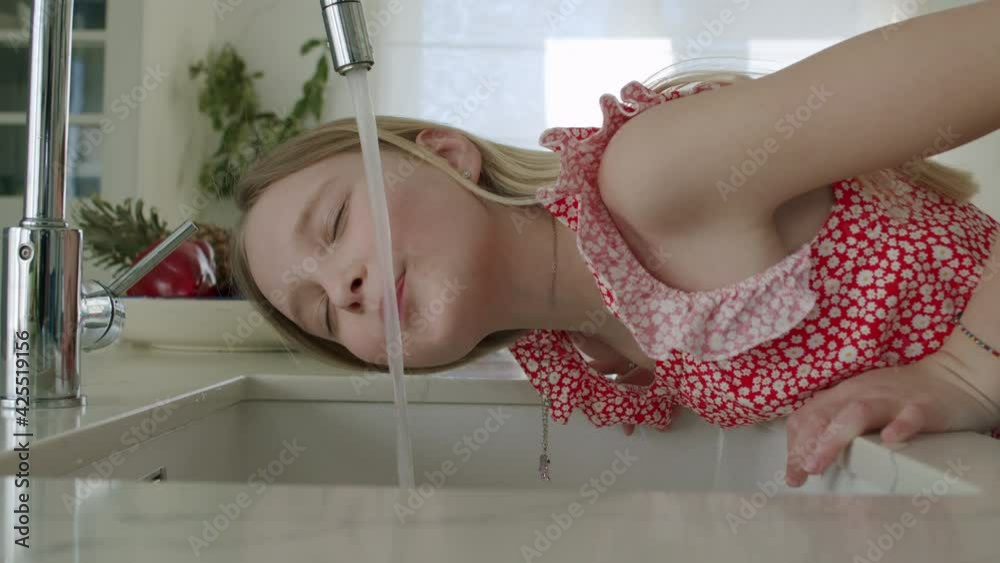 Girl tries drink tap water