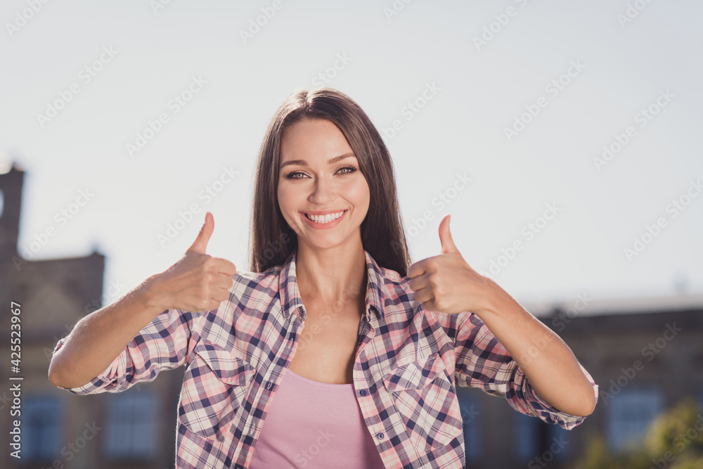 Photo of charming cheerful young student girl show thumbs up recommend education outdoor outside college Photo of charming cheerful young student girl show thumbs up recommend education outdoor outside college