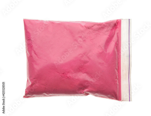 Pink powder in plastic bag isolated on white, top view. Holi festival celebration