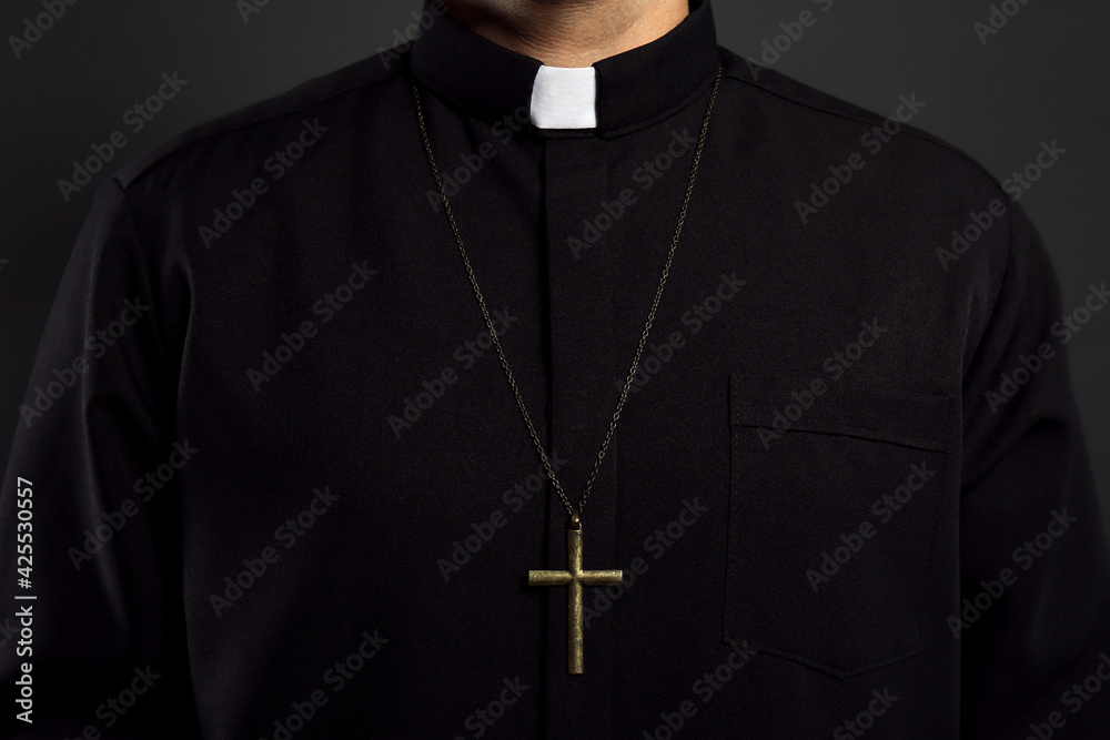 Priest with cross on black background, closeup - obrazy, fototapety, plakaty 