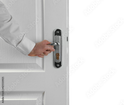 Man opening wooden door on white background, closeup
