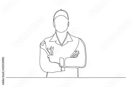 Continuous line drawing of young male mechanic pose holding set of wrench. Single one line art of man professional job profession minimalist concept. vector illustration