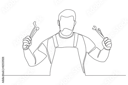Continuous line drawing of young male mechanic pose holding set of wrench. Single one line art of man professional job profession minimalist concept. vector illustration