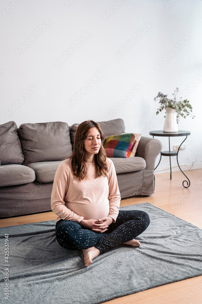 Beautiful Pregnant Woman Doing Yoga At Home. Beautiful Pregnant Woman Doing Yoga At Home.