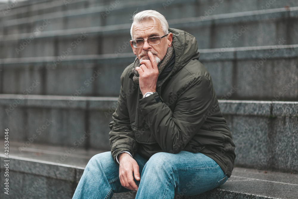 Suspicion and distrust. A mature man thinks about the future outside. The carefree are dreaming of retirement. Suspicion and distrust. A mature man thinks about the future outside. The carefree are dreaming of retirement.