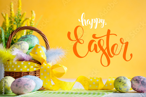 Happy Easter. Congratulatory easter background. Easter eggs and flowers. Selective focus. .Horizontal