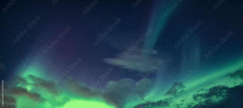 Aurora Borealis or Northern Lights with starry glowing in the night sky