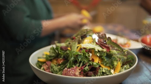 woman preparing cooking making vegetable salad in kitchen