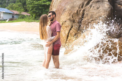 couple in love walking on the beach in Thailand