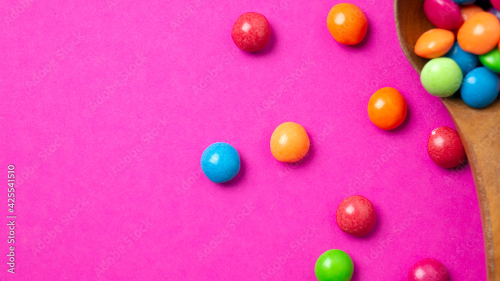 multicolored candy set with a wooden spoon multicolored candy set with a wooden spoon
