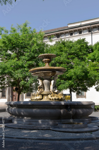 Milan, neo-classical fountain in the middle of the Piazza Fontana square, near the Piazza del Duomo. Lombardy Italy
